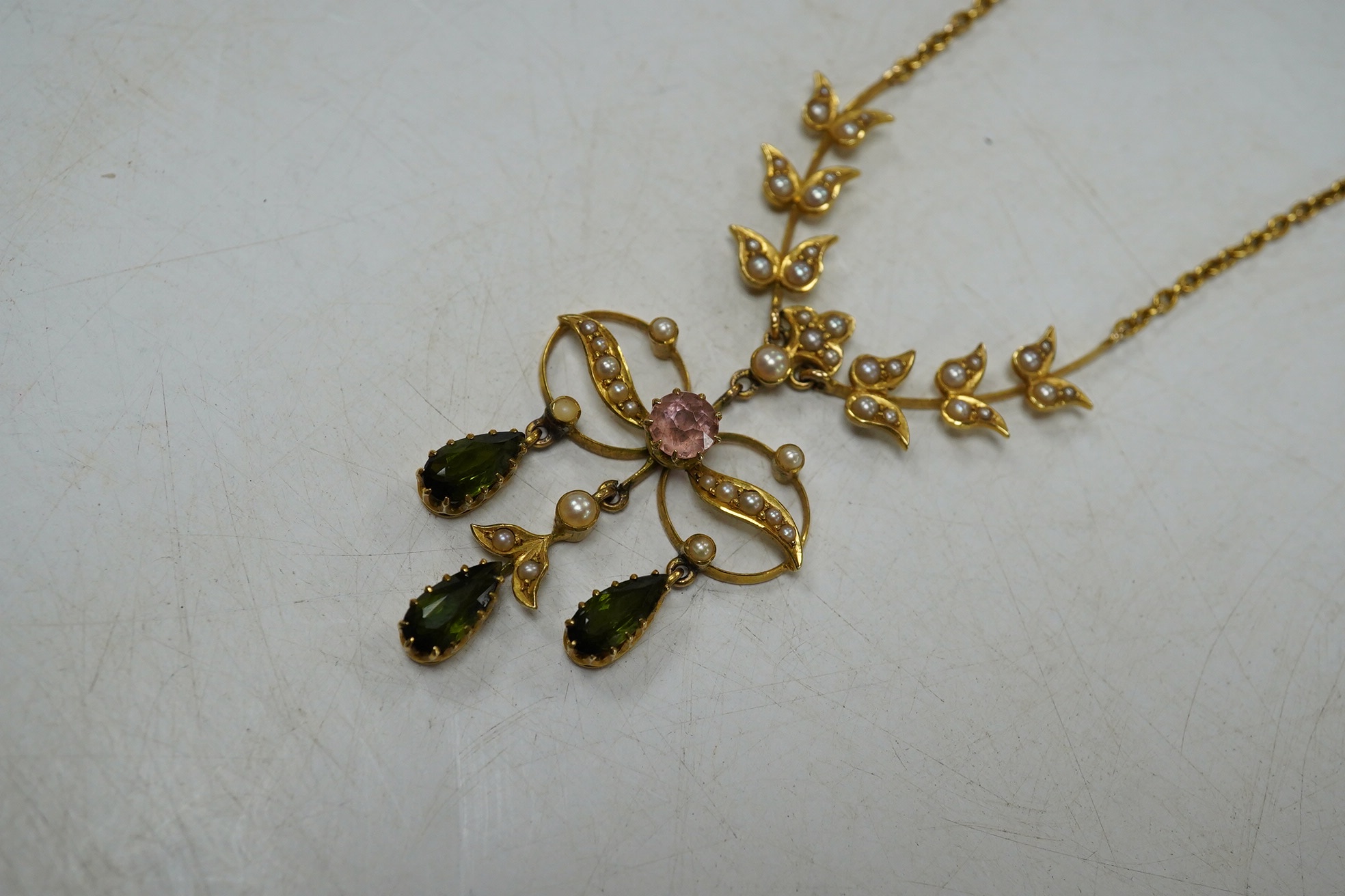 An early 20th century yellow metal and gem cluster set drop pendant necklace, 45cm, gross weight 12.7 grams. Condition - fair to good